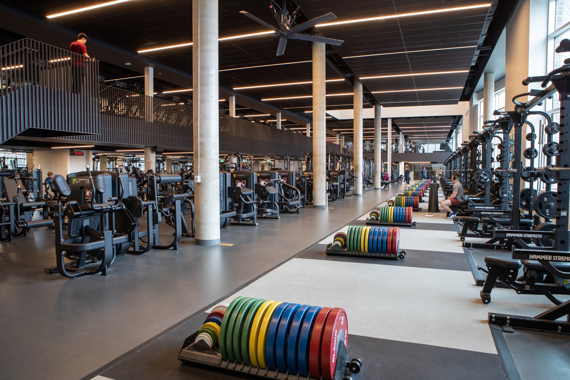 Student fitness center with dumbbell racks and weight plates