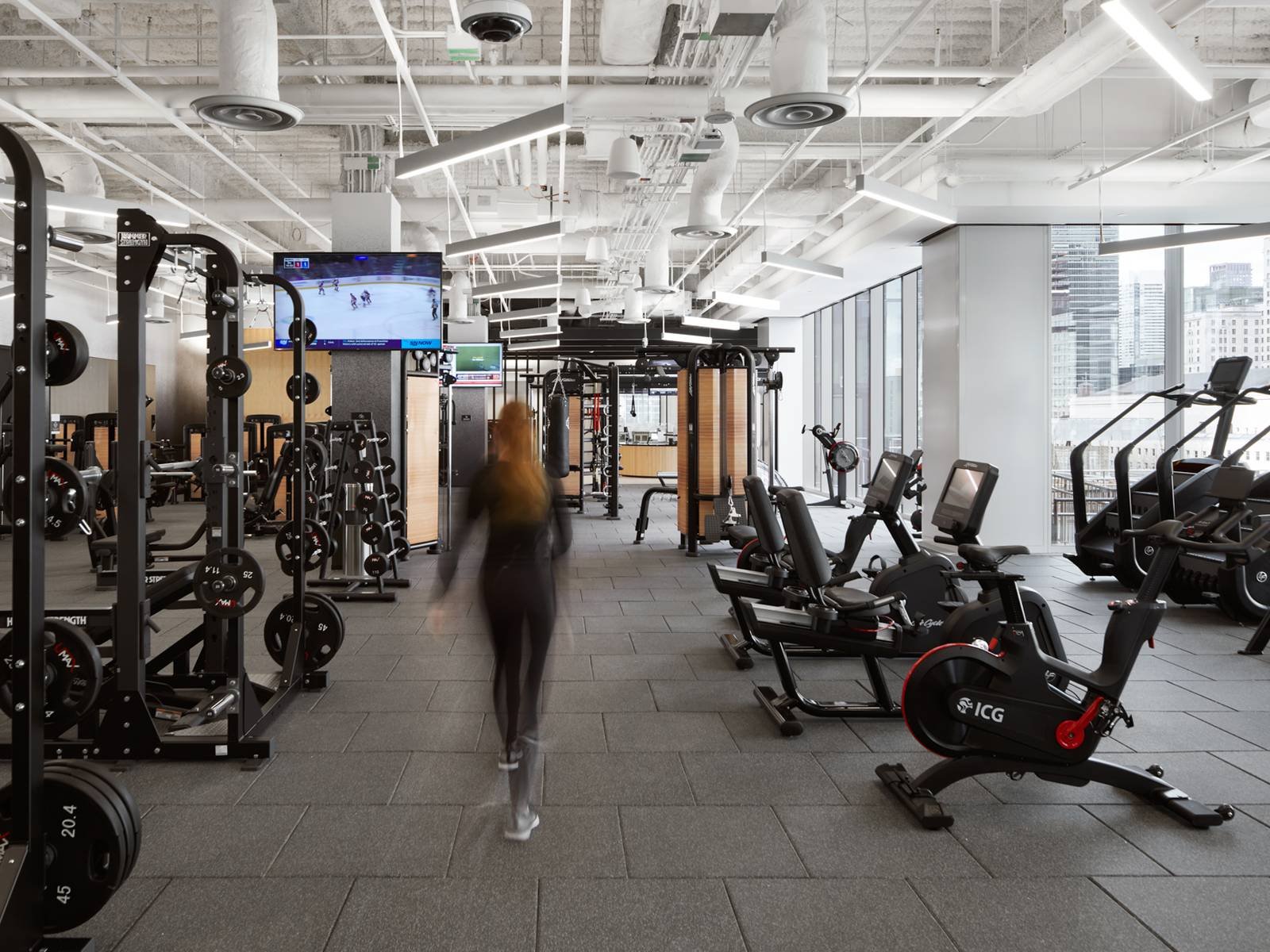 Corporate fitness center with cardio and strength equipment
