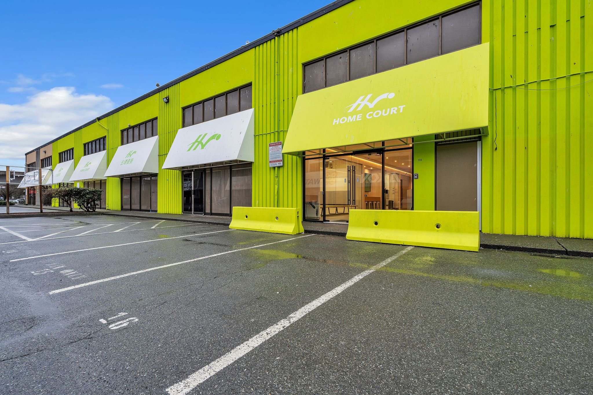 Exterior of a lime-green commercial fitness facility
