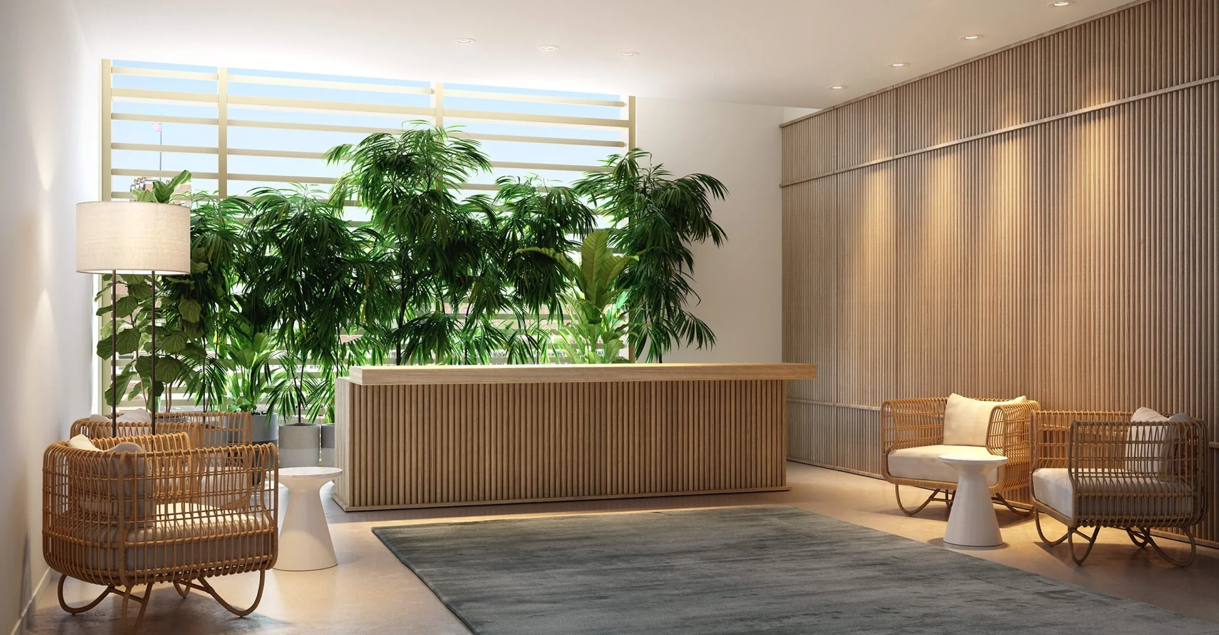 Spa reception with a timber slat wall, planting and rattan lounge chairs