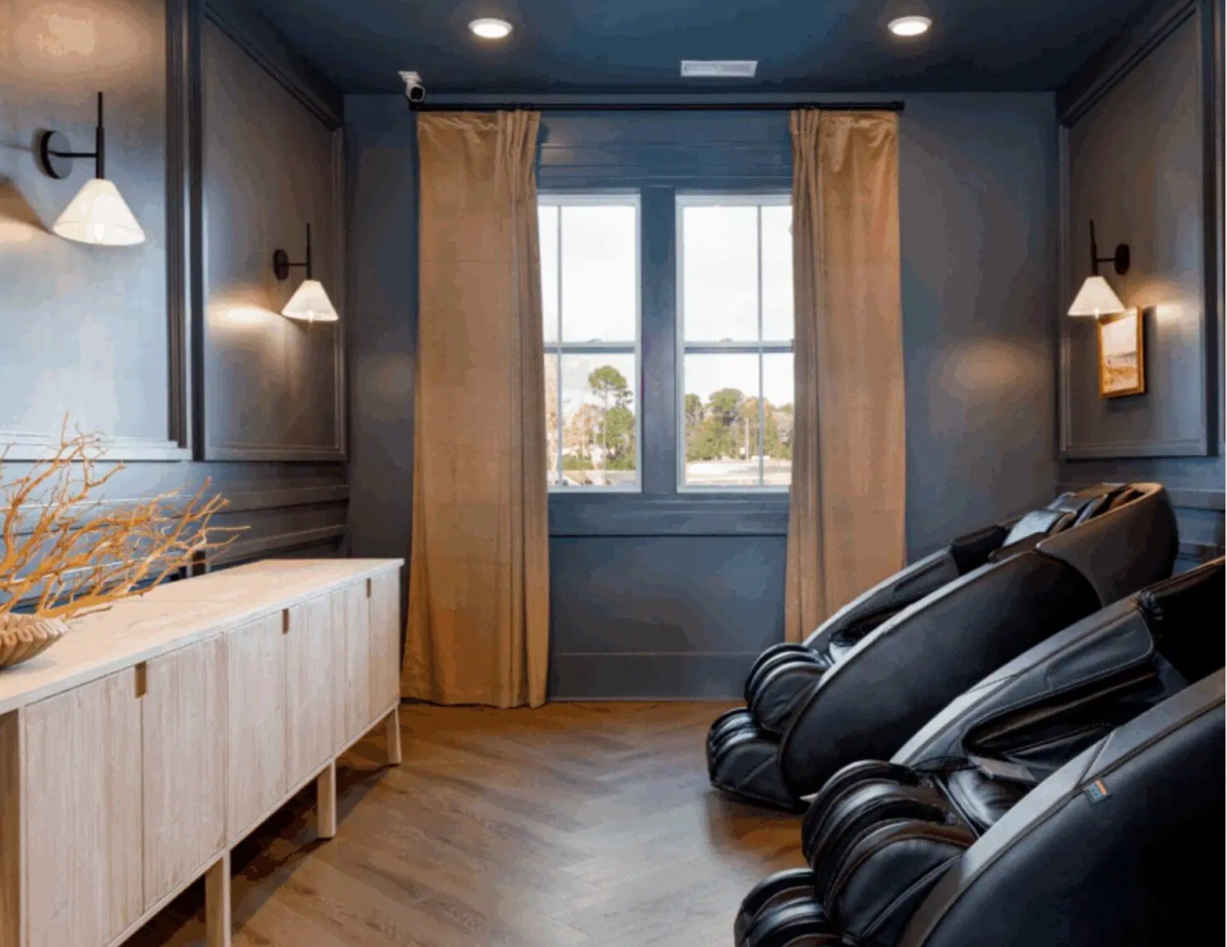 Massage chairs in a wellness lounge with soft lighting